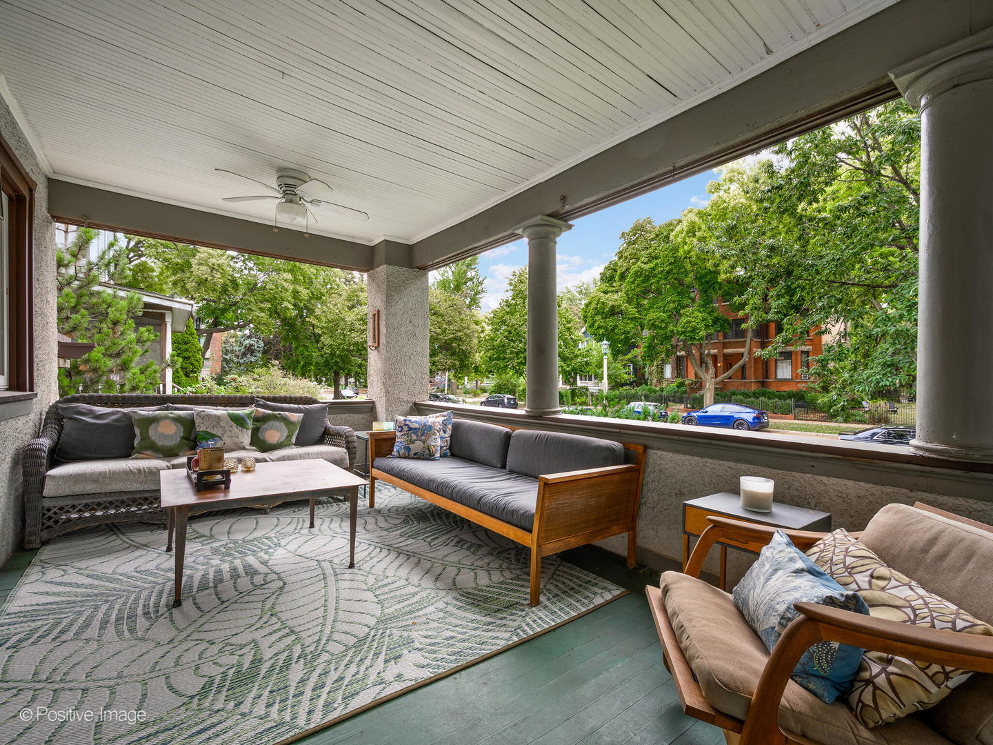 225 Clinton Avenue Oak Park, IL 60302 - Photo 8 of 37 a living room with patio furniture and a large window