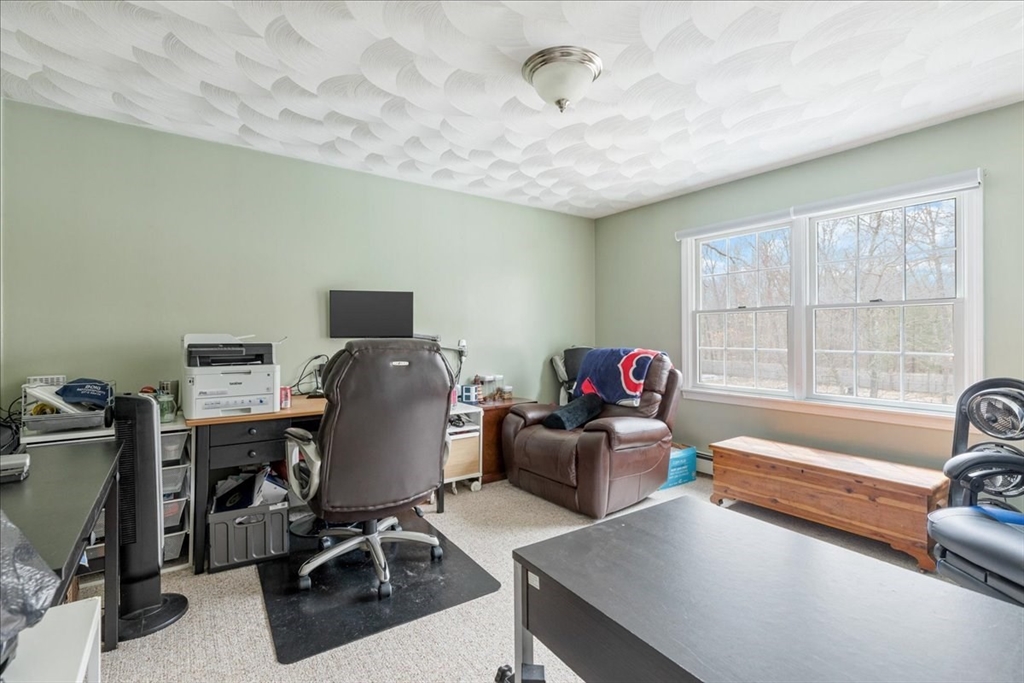 5 Lynn Street Taunton, MA 02780 - Photo 12 of 26 a livingroom with workspace and a window