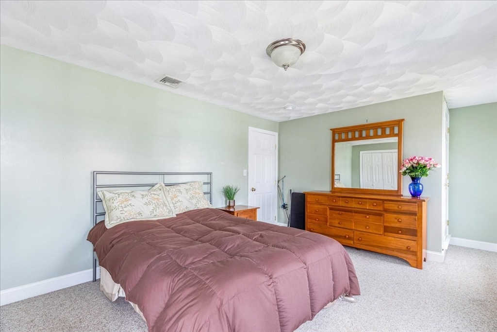 5 Lynn Street Taunton, MA 02780 - Photo 14 of 26 a bedroom with a bed and a dresser