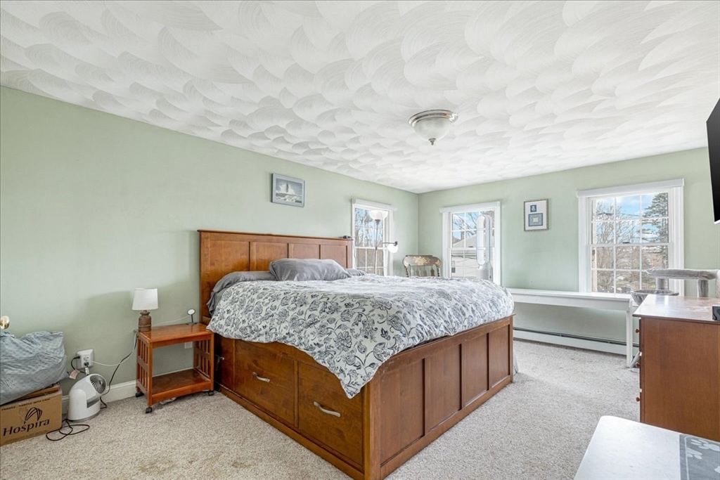 5 Lynn Street Taunton, MA 02780 - Photo 15 of 26 a bedroom with a bed and a dresser