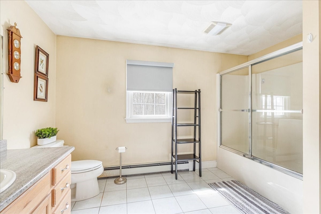 5 Lynn Street Taunton, MA 02780 - Photo 16 of 26 a bathroom with a toilet a sink and shower