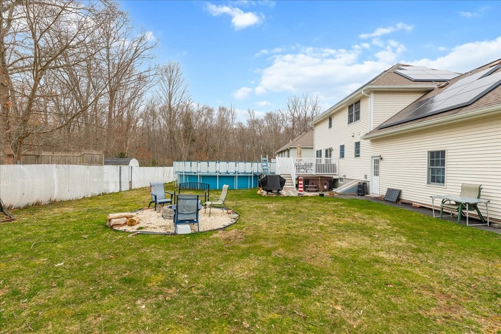 5 Lynn Street Taunton, MA 02780 - Photo 23 of 26 a backyard of a house with table and chairs