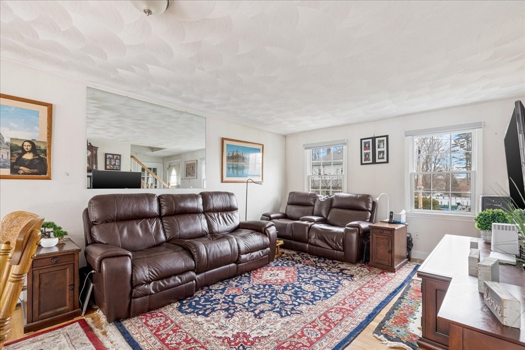 5 Lynn Street Taunton, MA 02780 - Photo 4 of 26 a living room with furniture or couch and a wooden floor
