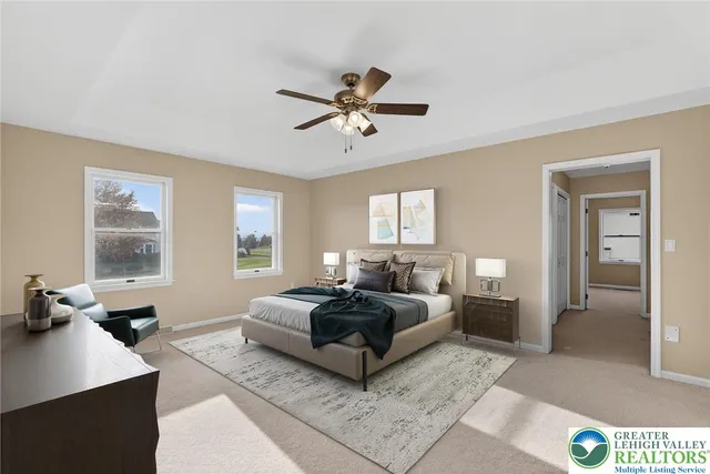 a spacious bedroom with a bed window and couch