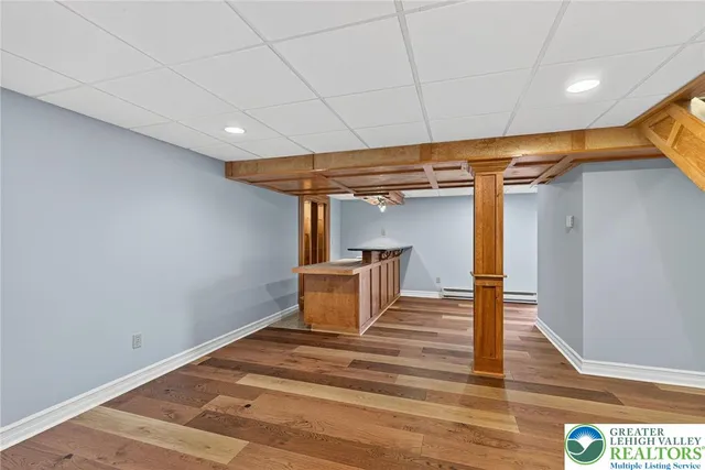 a view of a room with wooden floor