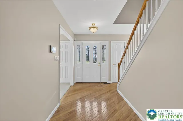a view of entryway with wooden floor