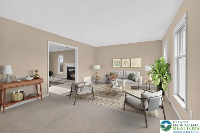 a living room with furniture and a potted plant