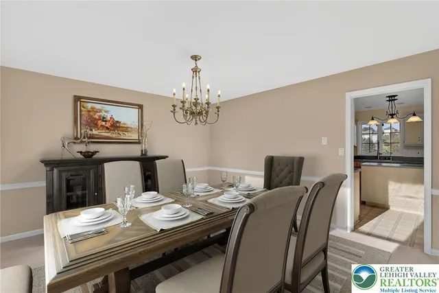 a view of a dining room with furniture a chandelier and wooden floor