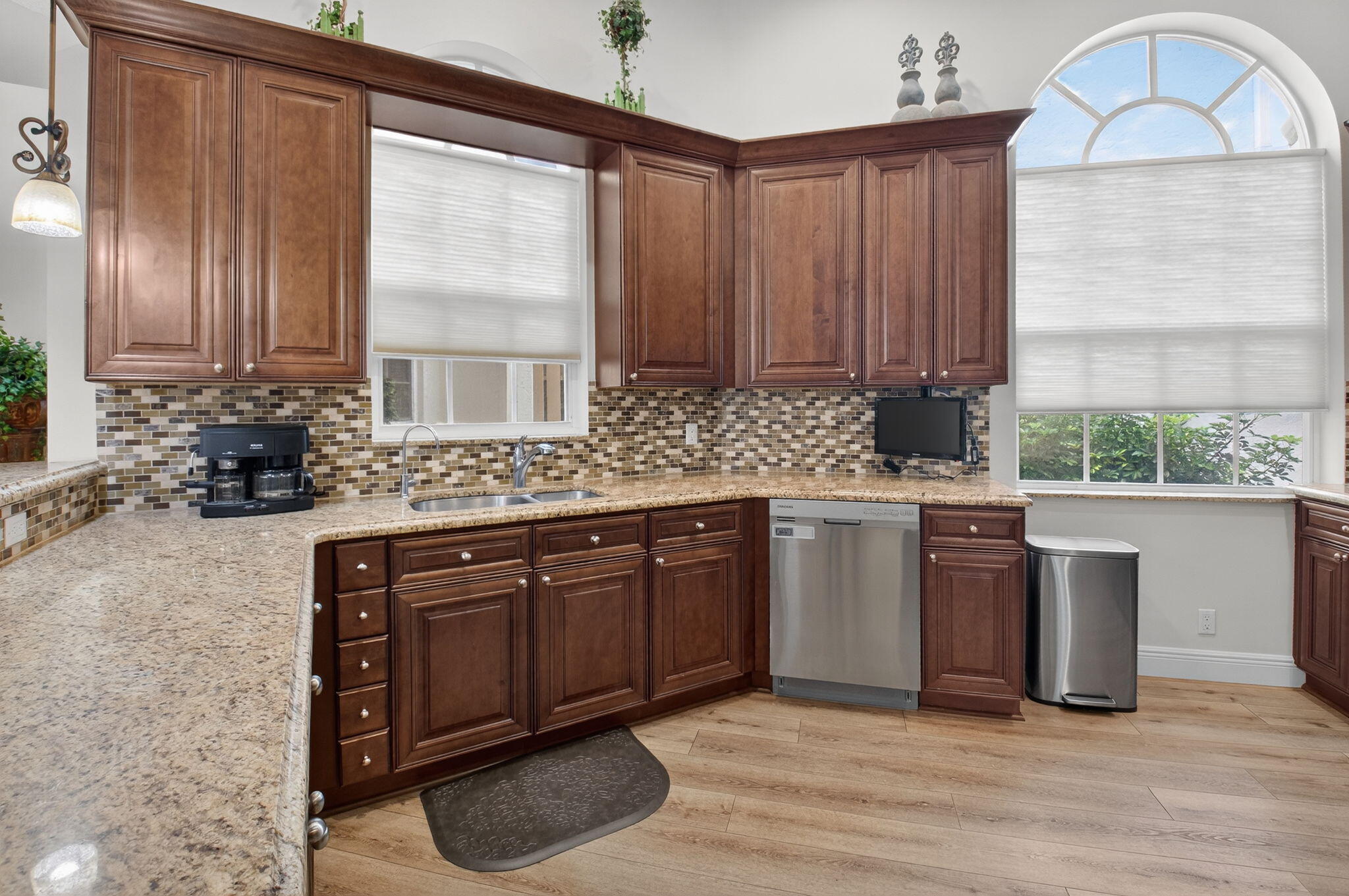2500 Northwest 66th Drive Boca Raton, FL 33496 - Photo 13 of 45 a kitchen with stainless steel appliances granite countertop a stove a sink and a microwave