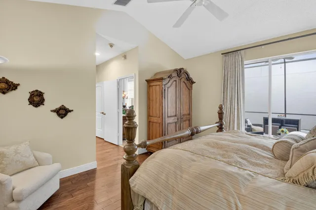 a bedroom with a bed couch and a window