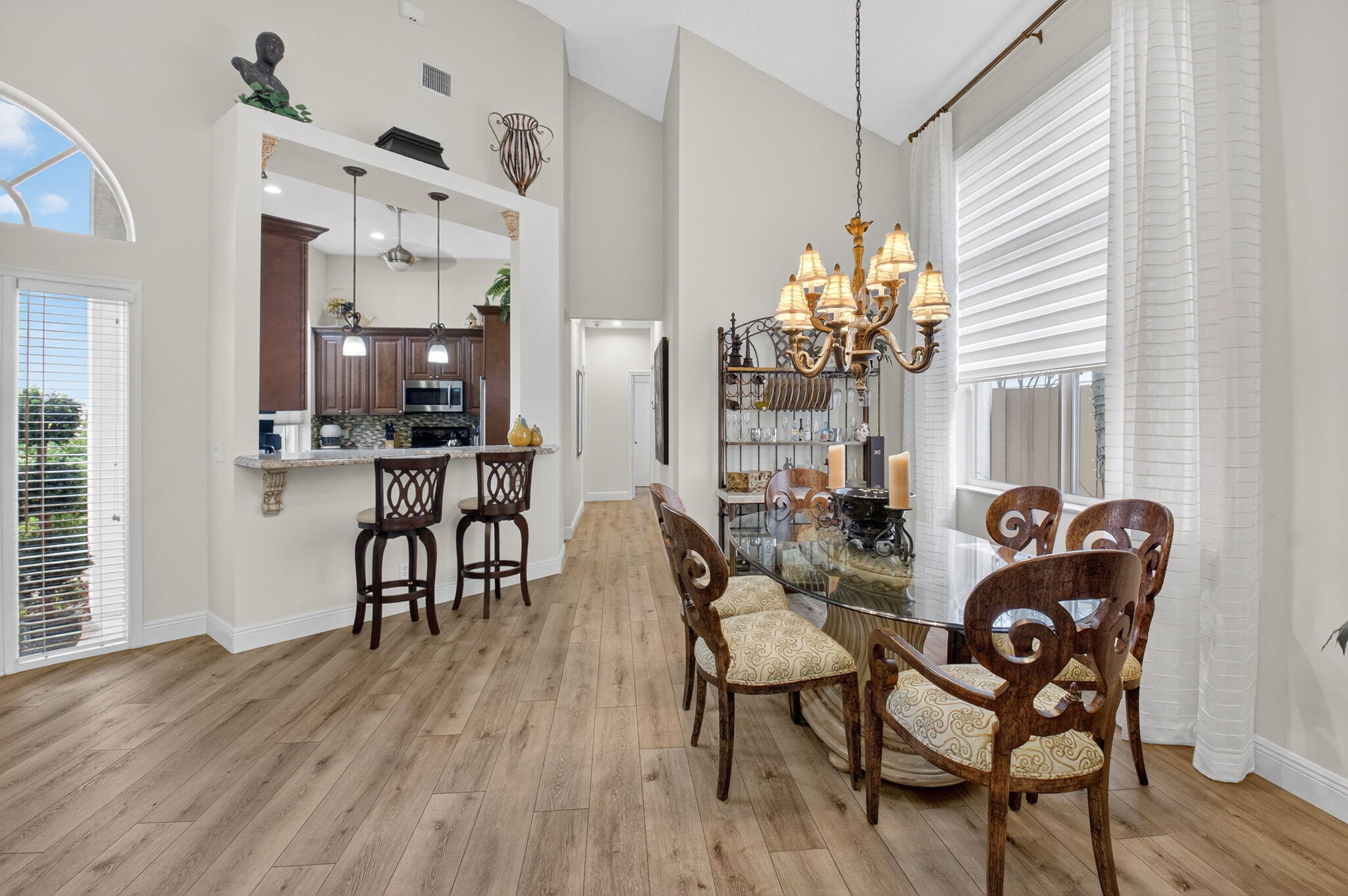 2500 Northwest 66th Drive Boca Raton, FL 33496 - Photo 7 of 45 a dining room filled chandelier and wooden floor