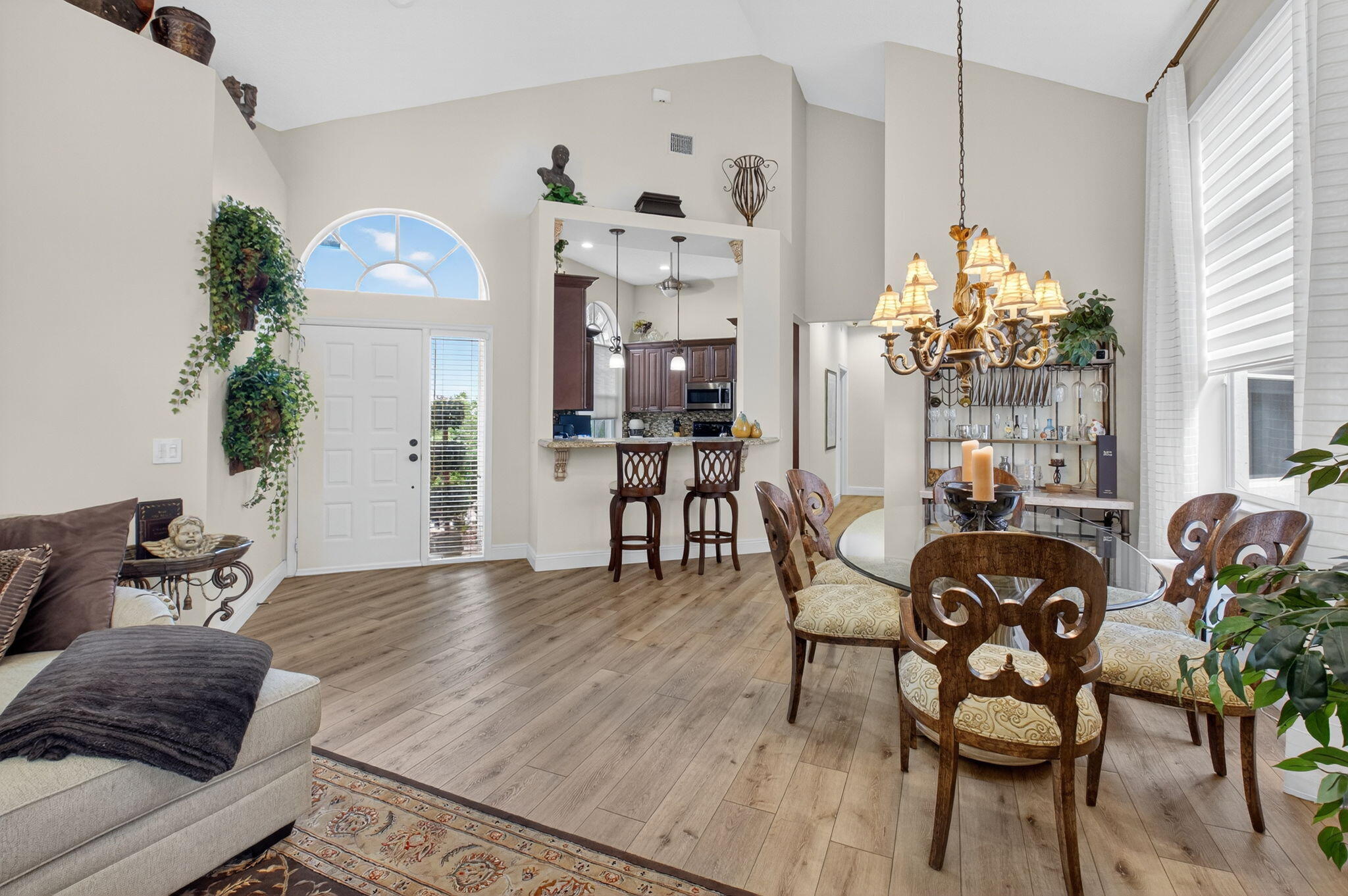 2500 Northwest 66th Drive Boca Raton, FL 33496 - Photo 8 of 45 a living room with furniture and a chandelier