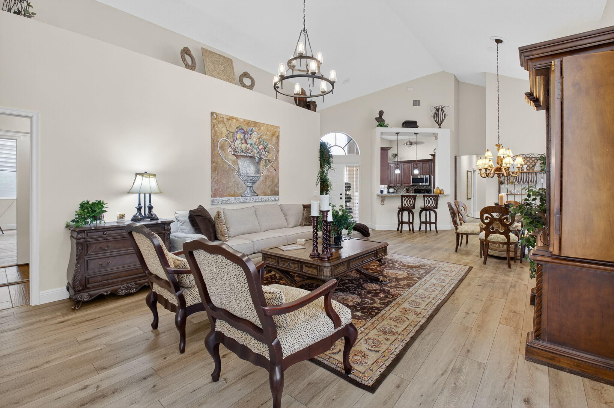 2500 Northwest 66th Drive Boca Raton, FL 33496 - Photo 9 of 45 a living room with furniture a chandelier and a flat screen tv