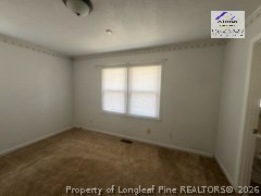 338 Summerhill Road Fayetteville, NC 28303 - Photo 17 of 28 an empty room with a window