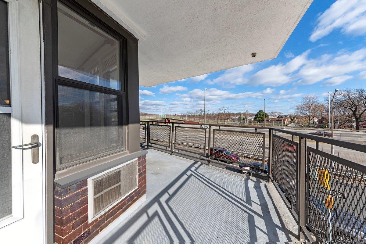 3121 Middletown Road, Unit 2K Bronx, NY 10461 - Photo 4 of 18 a view of a balcony with wooden floor and city view