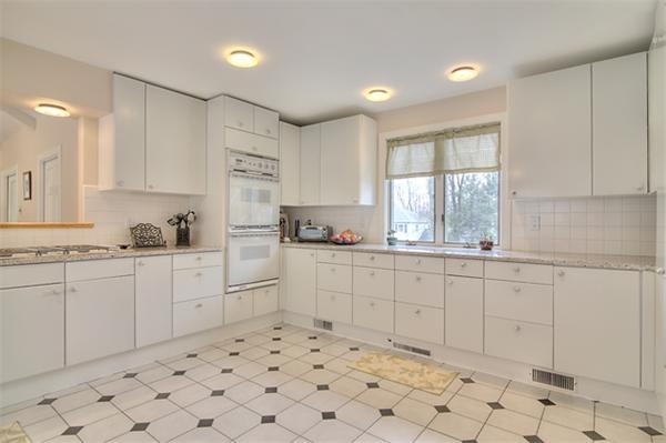 23 Blueberry Hill Road Andover, MA 01810 - Photo 11 of 30 a kitchen with white cabinets appliances and a sink
