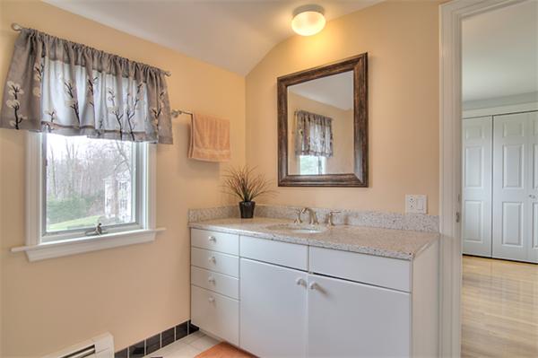 23 Blueberry Hill Road Andover, MA 01810 - Photo 23 of 30 a bathroom with a sink and a mirror