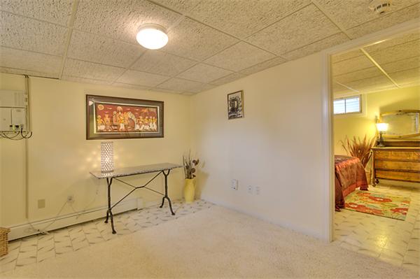 23 Blueberry Hill Road Andover, MA 01810 - Photo 28 of 30 a view of a hallway with wooden floor and a bathroom