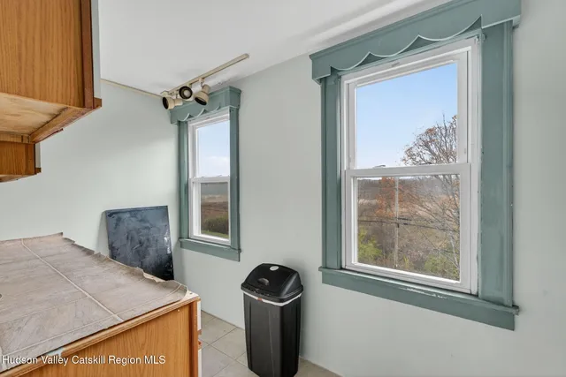 a view of a door and a window in a room