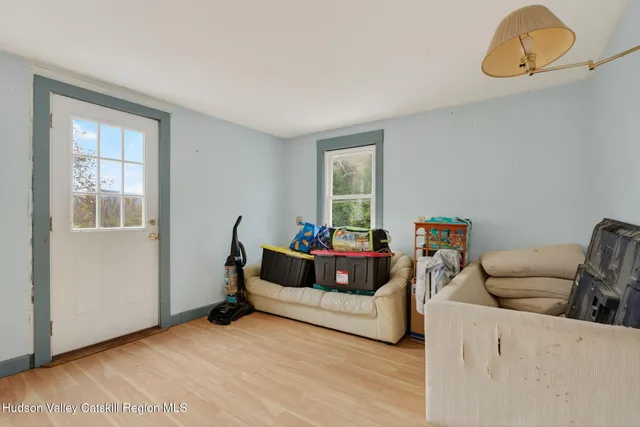 a living room with furniture and a window