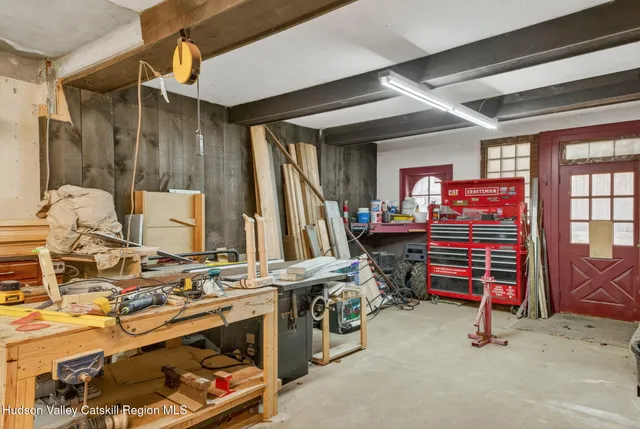 a view of a house with a yard and mountain view