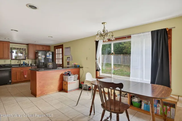 a dining room with furniture and window