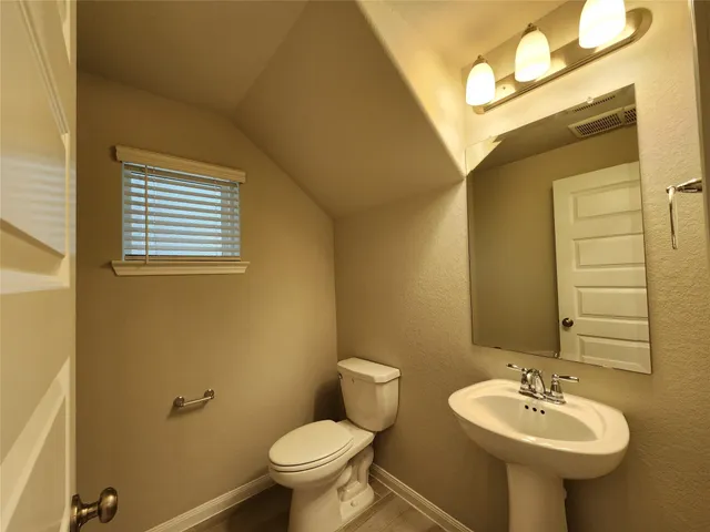 a bathroom with a sink and a toilet