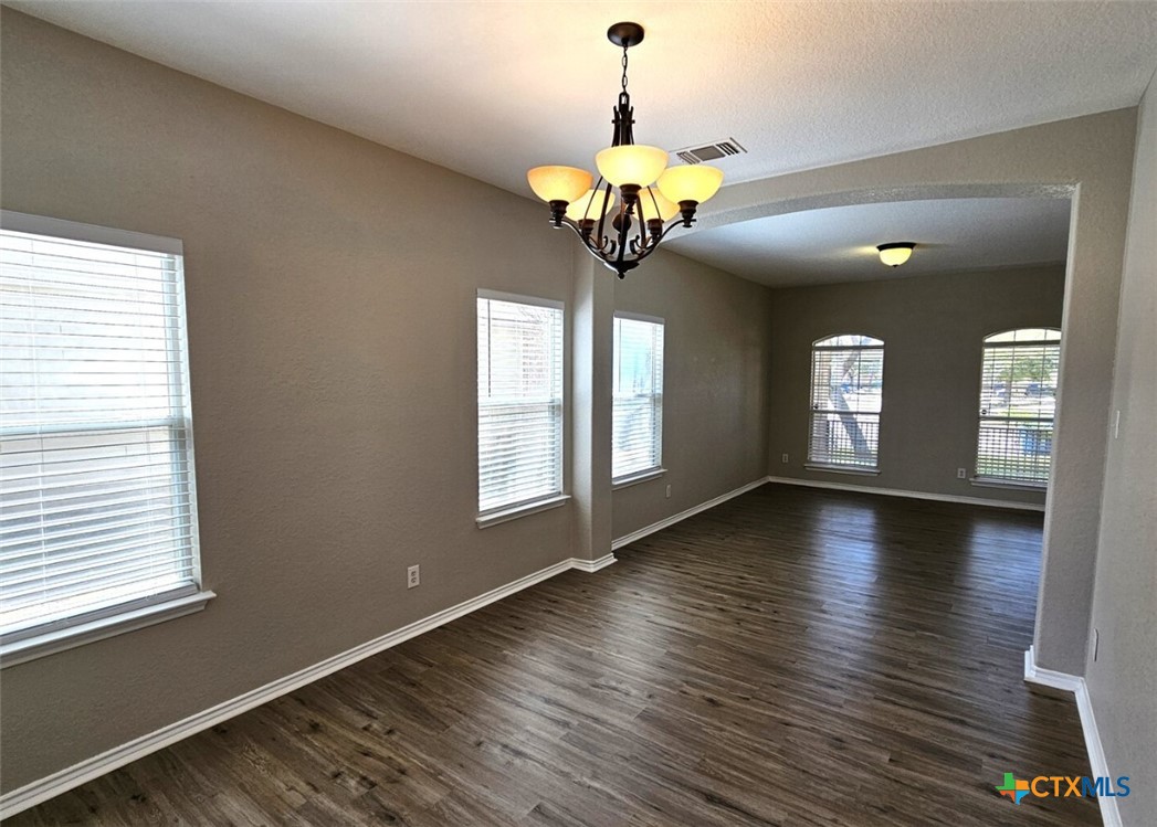 316 Julian Point Cibolo, TX 78108 - Photo 10 of 28 a view of a room with wooden floor and chandelier