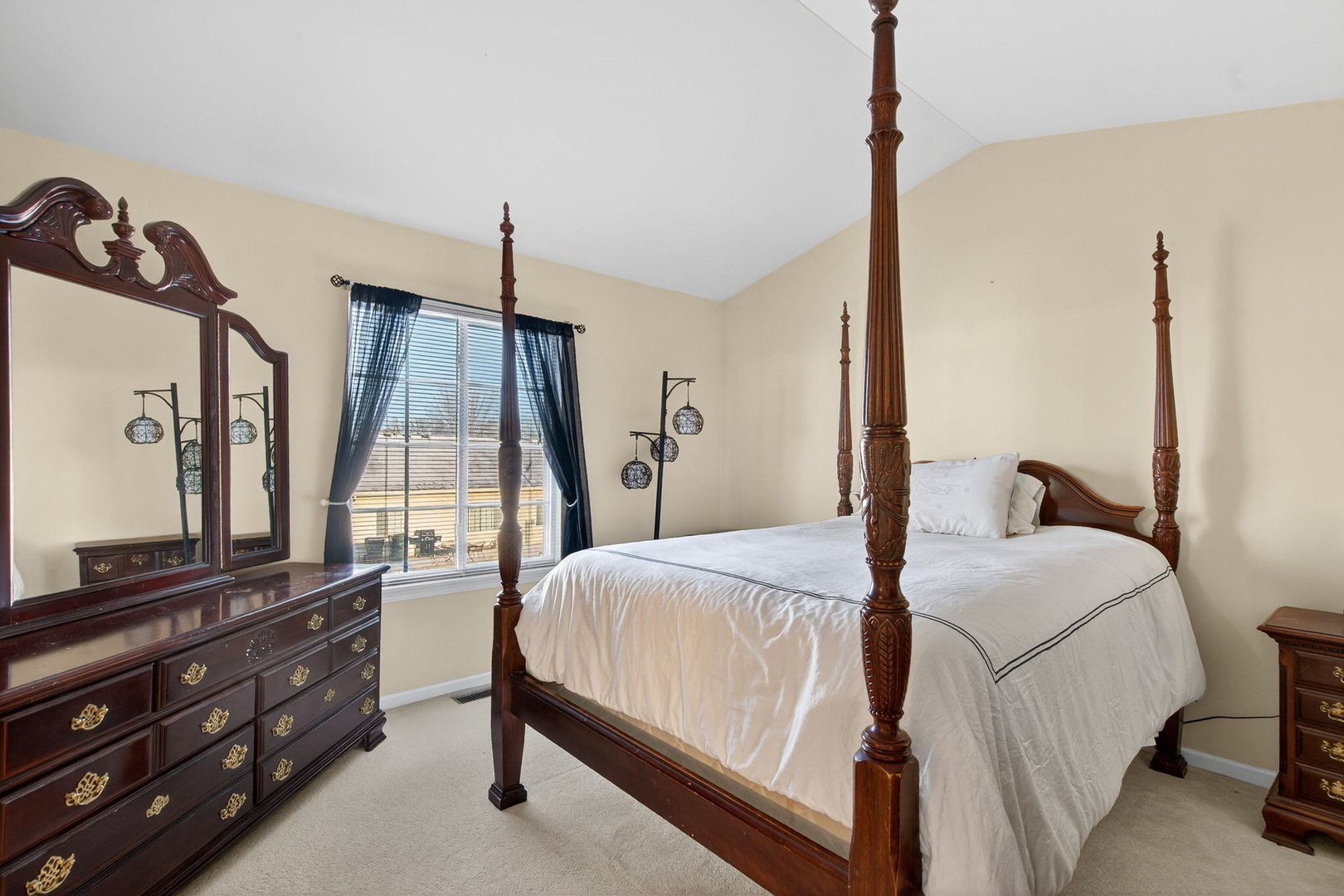 1429 Levato Lane Minooka, IL 60447 - Photo 14 of 27 a room with a bed window and a flat screen tv