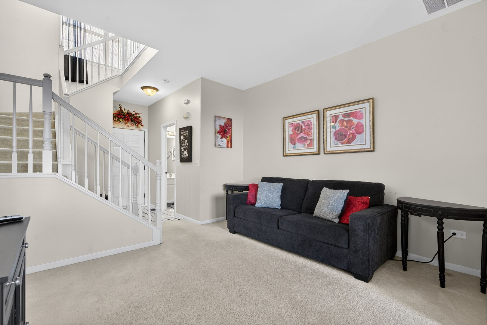 1429 Levato Lane Minooka, IL 60447 - Photo 3 of 27 a living room with furniture and stairs