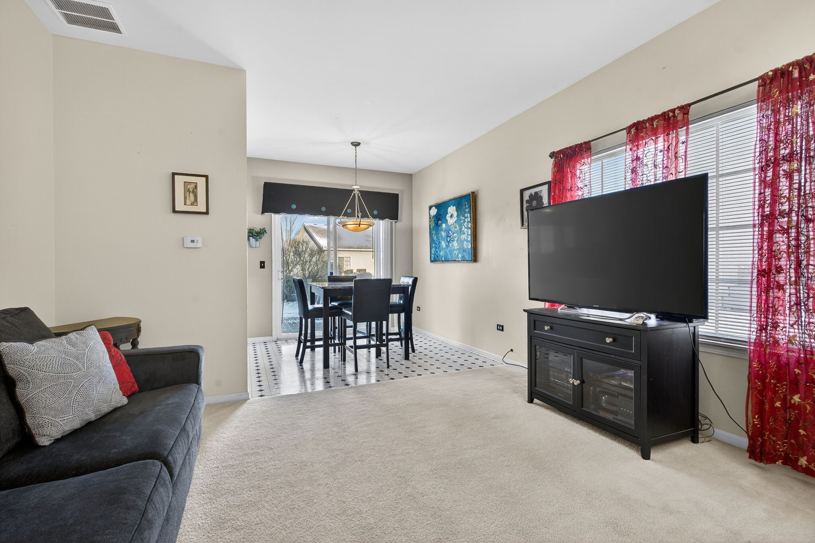 1429 Levato Lane Minooka, IL 60447 - Photo 4 of 27 a living room with furniture and a flat screen tv