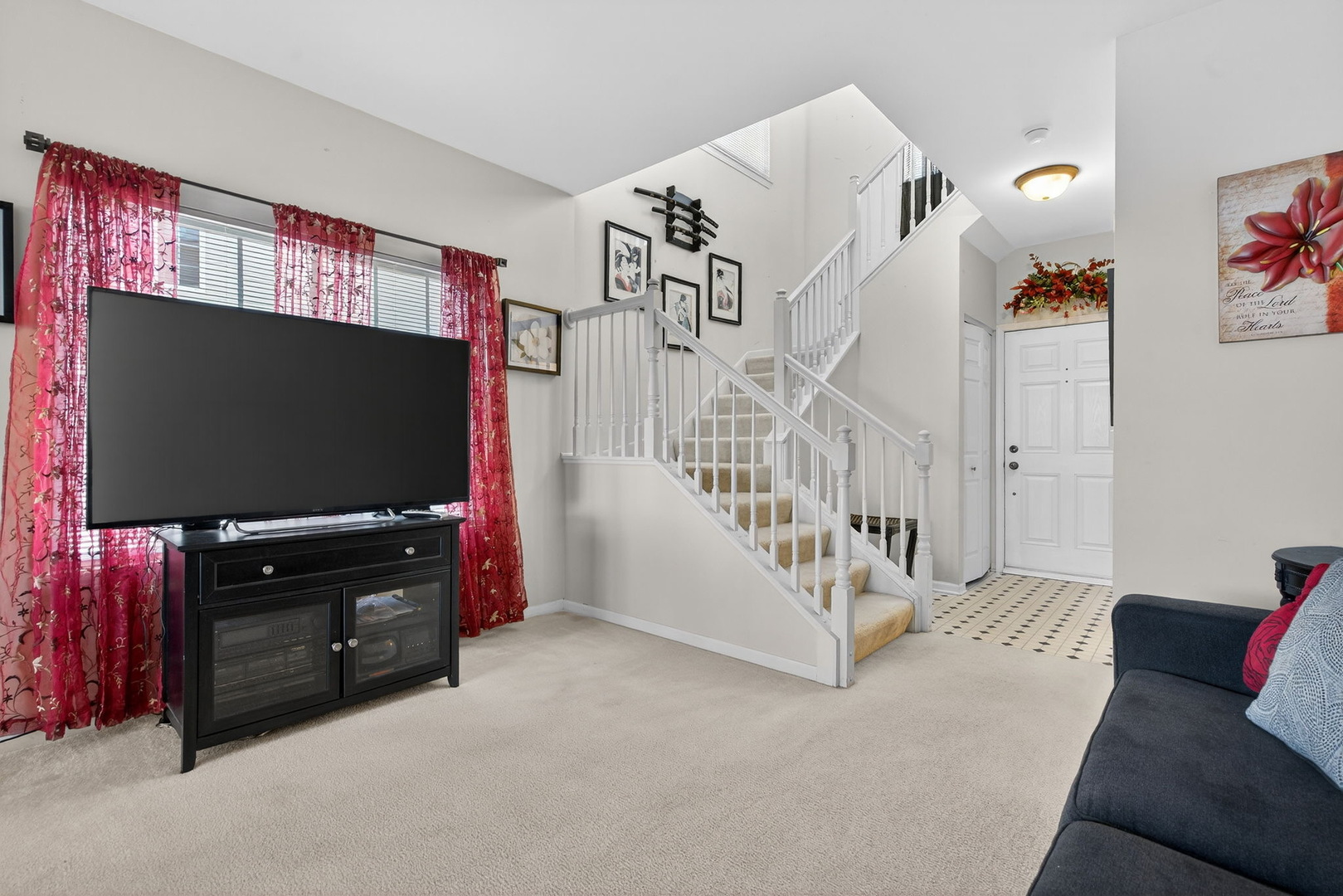 1429 Levato Lane Minooka, IL 60447 - Photo 6 of 27 a living room with furniture and a flat screen tv