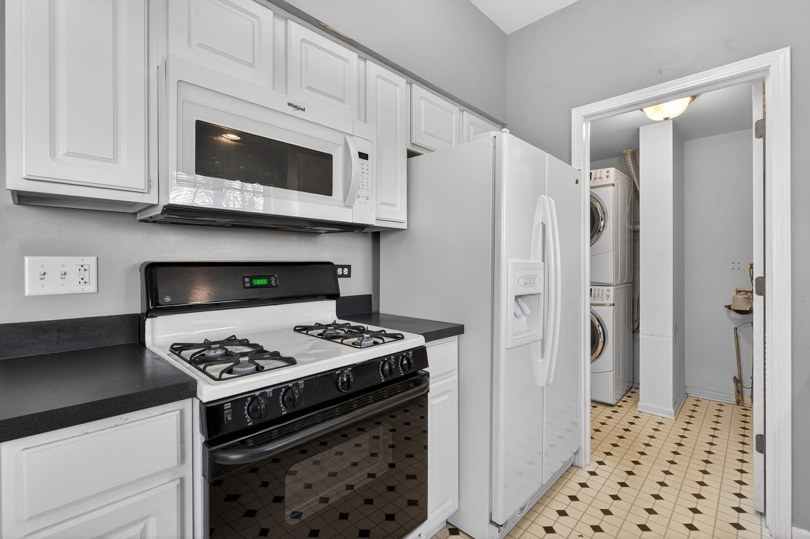 1429 Levato Lane Minooka, IL 60447 - Photo 8 of 27 a kitchen with stainless steel appliances a refrigerator a stove and a stove