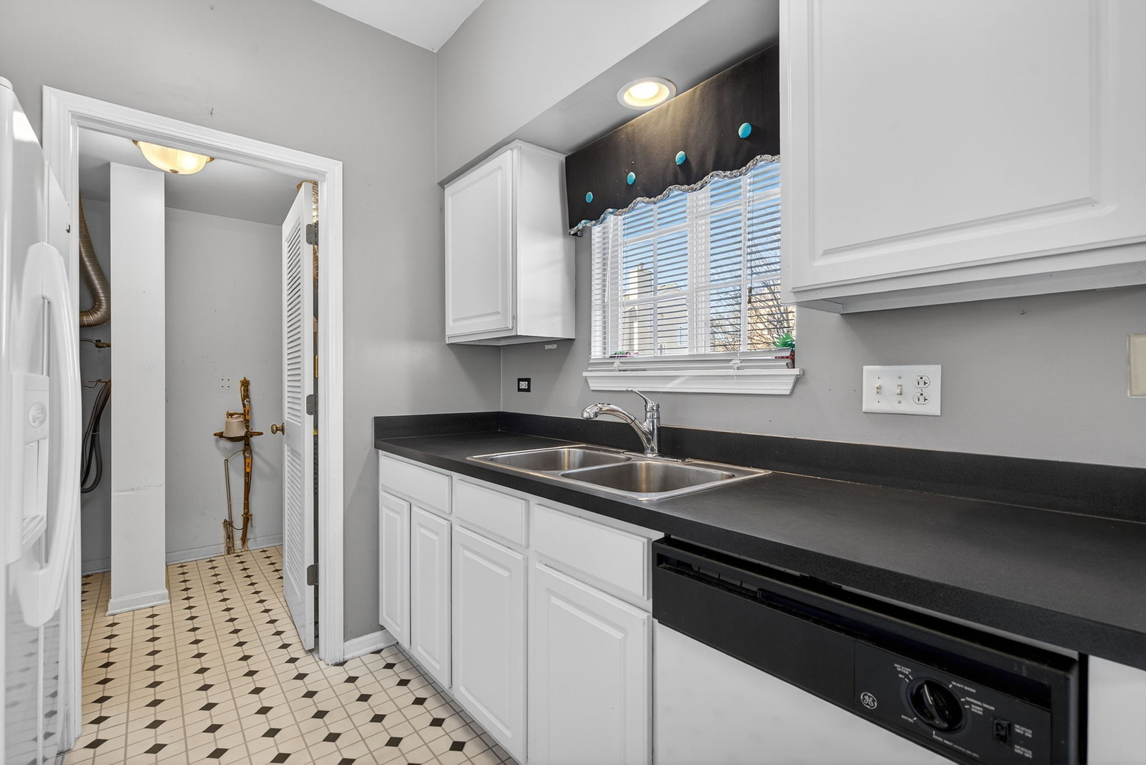 1429 Levato Lane Minooka, IL 60447 - Photo 9 of 27 a kitchen with granite countertop a sink cabinets and window