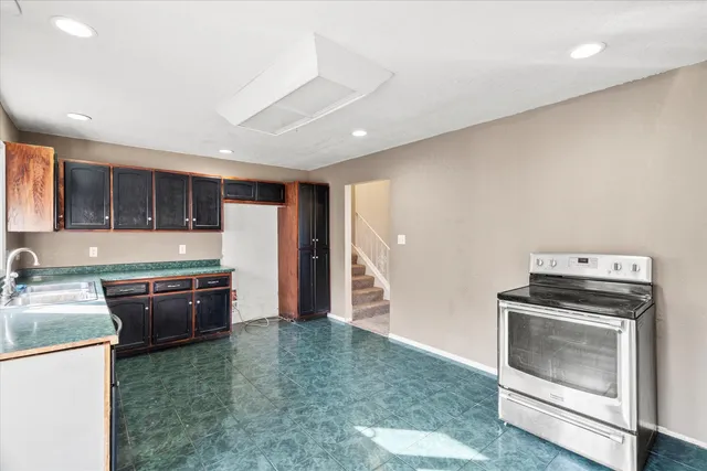 a large bathroom with a large tub and sink