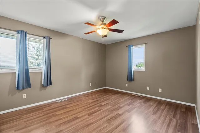 a bathroom with a double vanity sink toilet and shower