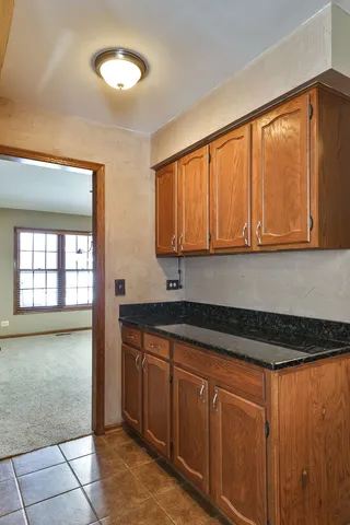 a kitchen with stainless steel appliances granite countertop a sink and cabinets