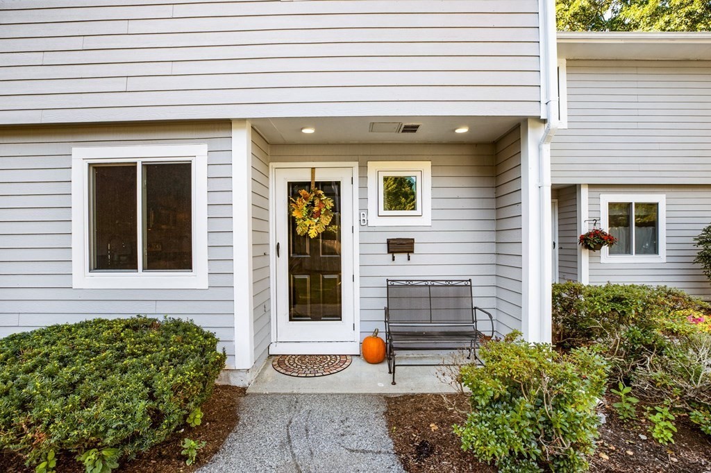 a view of brick house with large windows