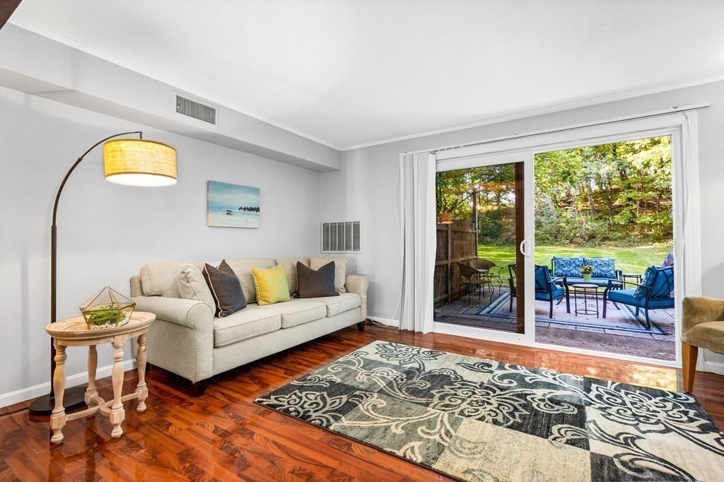 5 Beal's Cove Road, Unit B Hingham, MA 02043 - Photo 13 of 27 a living room with furniture and a table