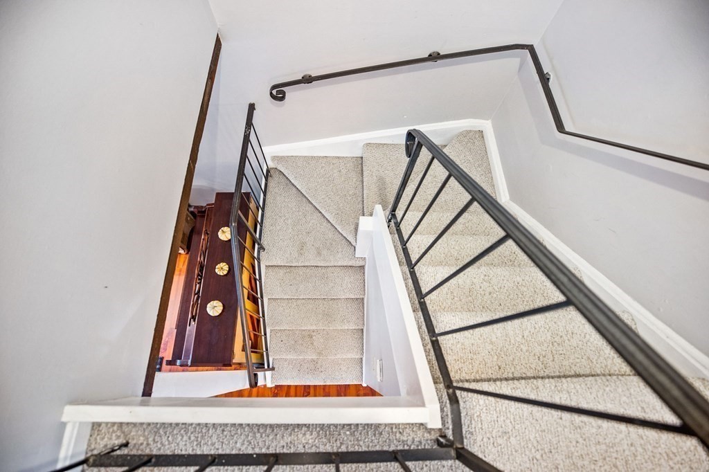 5 Beal's Cove Road, Unit B Hingham, MA 02043 - Photo 16 of 27 a view of staircase with white walls and a window