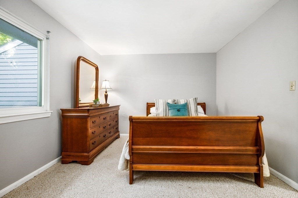 5 Beal's Cove Road, Unit B Hingham, MA 02043 - Photo 18 of 27 a view of bedroom with furniture and wooden floor