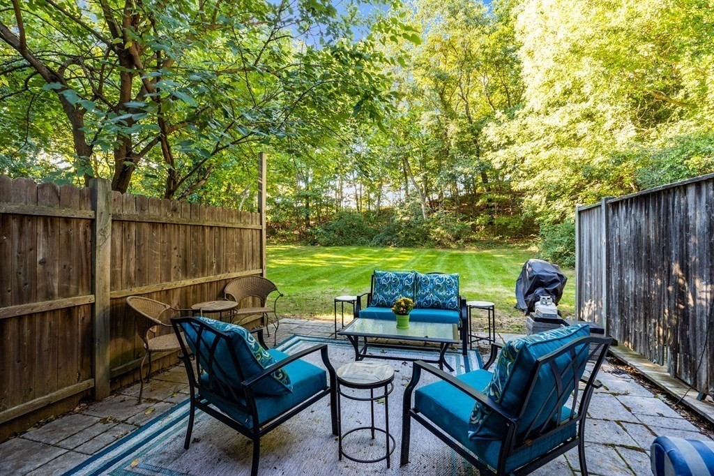 5 Beal's Cove Road, Unit B Hingham, MA 02043 - Photo 23 of 27 a view of a patio with chairs and a table