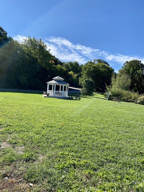 5 Beal's Cove Road, Unit B Hingham, MA 02043 - Photo 25 of 27 a view of a house with a big yard