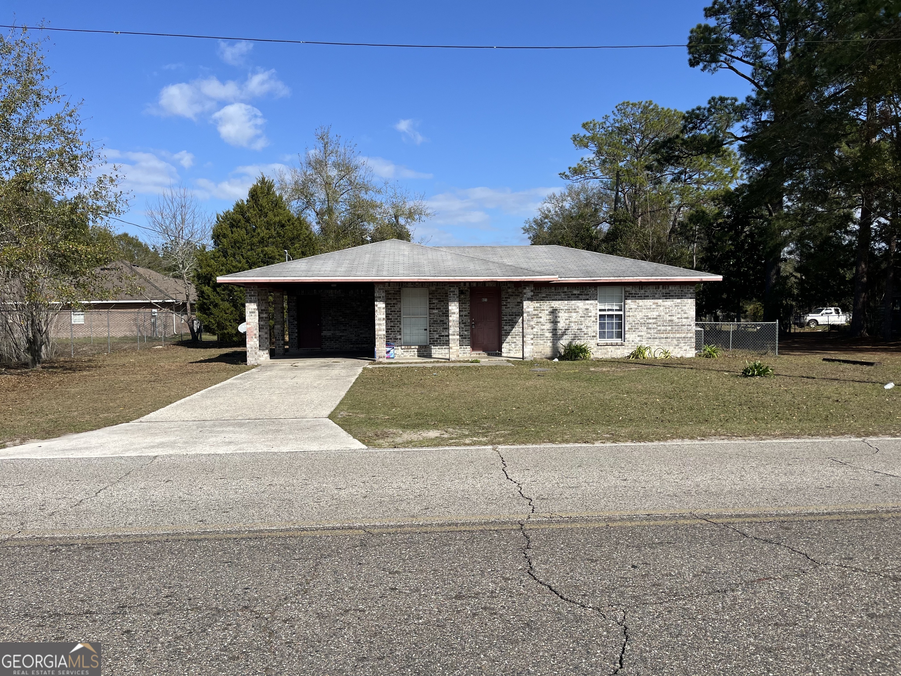 621 Pinewood Street Folkston, GA 31537 - Photo 1 of 14 a view of house with outdoor space and parking