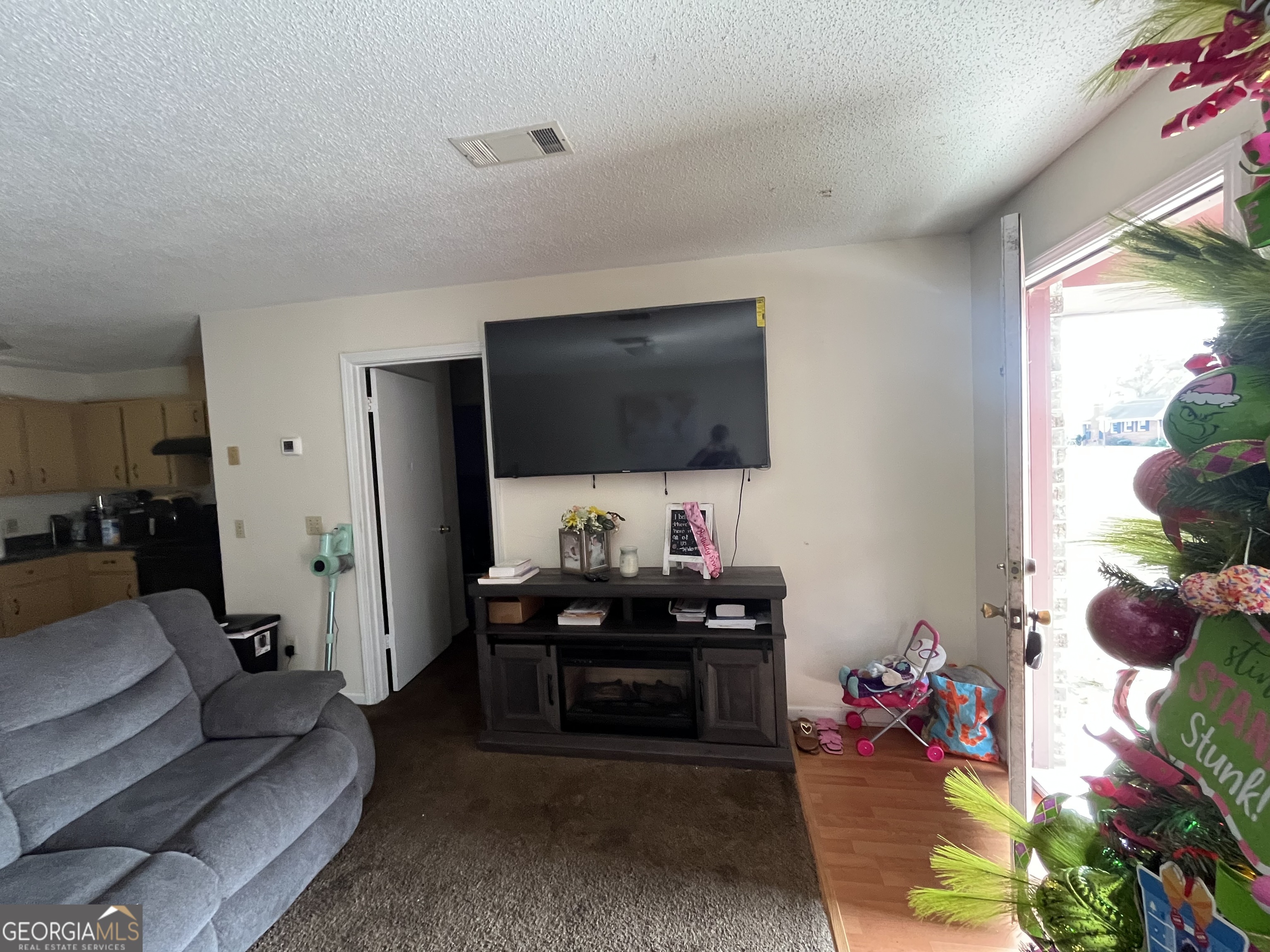 621 Pinewood Street Folkston, GA 31537 - Photo 7 of 14 a living room with furniture and a flat screen tv