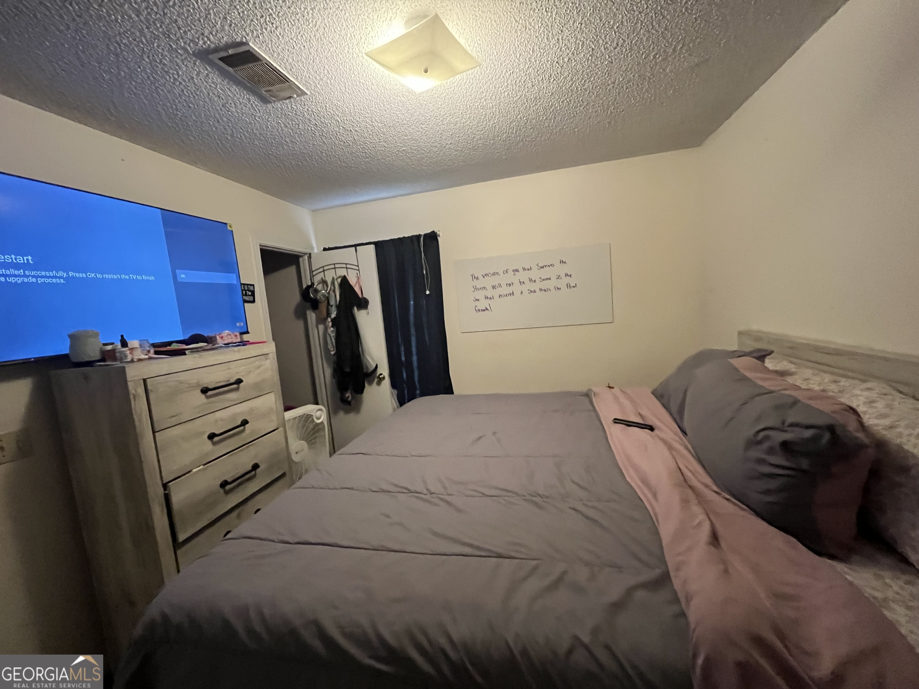 621 Pinewood Street Folkston, GA 31537 - Photo 9 of 14 a bedroom with a bed and a closet