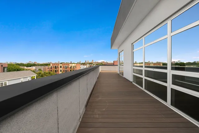 a view of balcony with furniture