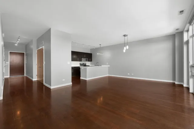 a view of a kitchen with a sink and a stove top oven
