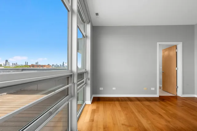 a view of an empty room and a window