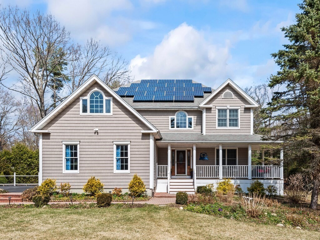9 Santom Street Auburn, MA 01501 - Photo 1 of 42 a front view of a house with garden